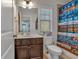 Cozy bathroom featuring a decorated shower curtain and a vanity sink at 3890 Pleasant Woods Dr, Cumming, GA 30028