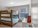 Neutral bedroom with a bunk bed and a window at 3890 Pleasant Woods Dr, Cumming, GA 30028