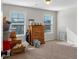 Empty bedroom with hardwood floors and bright windows at 3890 Pleasant Woods Dr, Cumming, GA 30028