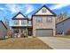 Charming two-story home with brick accents and a well-manicured lawn offers great curb appeal at 3890 Pleasant Woods Dr, Cumming, GA 30028
