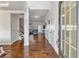 Welcoming foyer with hardwood floors, white trim, and views of living space at 3890 Pleasant Woods Dr, Cumming, GA 30028