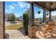 Inviting front porch with rocking chairs, flowers, and views of the landscaped yard at 3890 Pleasant Woods Dr, Cumming, GA 30028
