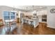 Bright kitchen with white cabinets, granite countertops, stainless steel appliances and a large island at 3890 Pleasant Woods Dr, Cumming, GA 30028
