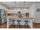 Spacious kitchen island with granite countertops, stainless steel appliances, and bar stool seating at 3890 Pleasant Woods Dr, Cumming, GA 30028