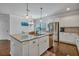 Modern kitchen with stainless steel appliances, granite countertops, and white cabinets at 3890 Pleasant Woods Dr, Cumming, GA 30028