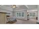 Spacious bedroom with tray ceilings, large windows, and plush carpeting creates a relaxing atmosphere at 3890 Pleasant Woods Dr, Cumming, GA 30028