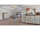 This main bedroom is spacious and bright, with ceiling fan, tray ceiling, dresser, and large bed at 3890 Pleasant Woods Dr, Cumming, GA 30028