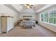 Spacious main bedroom with vaulted ceilings, carpet, and natural light at 3890 Pleasant Woods Dr, Cumming, GA 30028