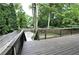 Elevated wooden deck overlooking a secluded yard, ideal for outdoor relaxation and entertaining at 657 S Grand Nw Ave, Atlanta, GA 30318