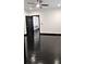 Spacious bedroom with black trim, shiny hardwood floors, and a view into another room at 657 S Grand Nw Ave, Atlanta, GA 30318