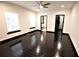 The bedroom has gleaming wood floors, two windows and two doors at 657 S Grand Nw Ave, Atlanta, GA 30318