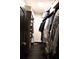 Well-organized walk-in closet with dark wood shelving, providing ample storage space at 657 S Grand Nw Ave, Atlanta, GA 30318