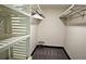 Walk-in closet with custom shelving, carpeted flooring, and ample storage space at 657 S Grand Nw Ave, Atlanta, GA 30318