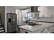 Kitchen view showcasing stainless steel appliances and quartz countertops at 657 S Grand Nw Ave, Atlanta, GA 30318