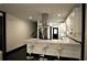 Open concept kitchen with sleek island, stainless steel appliances and bar stool seating at 657 S Grand Nw Ave, Atlanta, GA 30318