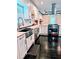 Well-appointed kitchen featuring stainless steel appliances, white cabinets, and stylish backsplash at 657 S Grand Nw Ave, Atlanta, GA 30318