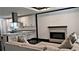 The living room features an elegant fireplace, stylish furniture, and barstool seating at 657 S Grand Nw Ave, Atlanta, GA 30318
