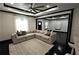 Spacious living room with a large sectional sofa, ceiling fan and open floor plan at 657 S Grand Nw Ave, Atlanta, GA 30318