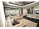 Open-concept living room boasts modern decor, a large sectional sofa, and a stylish rug at 657 S Grand Nw Ave, Atlanta, GA 30318