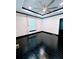 Bright living room with large windows, tray ceilings, dark trim, and hardwood floors at 657 S Grand Nw Ave, Atlanta, GA 30318
