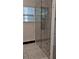Modern bathroom with large glass shower doors and marble tile surround at 657 S Grand Nw Ave, Atlanta, GA 30318