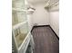 A walk-in closet featuring shelving, carpet and storage drawers at 657 S Grand Nw Ave, Atlanta, GA 30318