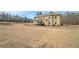 Expansive backyard with a covered patio, ideal for outdoor entertaining and relaxation at 10 Tabor Trce, Oxford, GA 30054