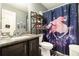 Comfortable bathroom featuring a granite vanity and a charming unicorn-themed shower curtain at 10 Tabor Trce, Oxford, GA 30054
