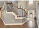 Elegant foyer with hardwood floors, staircase, and decorative front door at 10 Tabor Trce, Oxford, GA 30054