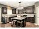 Stylish kitchen with granite counters, stainless appliances, and center island with seating at 10 Tabor Trce, Oxford, GA 30054