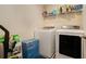Well-equipped laundry room featuring modern washer and dryer, plus ample storage space at 10 Tabor Trce, Oxford, GA 30054