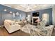 Bright and airy living room with a fireplace and plush seating at 10 Tabor Trce, Oxford, GA 30054