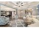 Spacious living room featuring hardwood floors, coffered ceilings, and comfortable seating at 10 Tabor Trce, Oxford, GA 30054