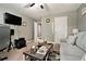 Relaxing living room featuring a comfortable sofa, modern rug, and ambient lighting at 10 Tabor Trce, Oxford, GA 30054