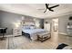 Spacious main bedroom with a tray ceiling, ceiling fan, and neutral decor at 10 Tabor Trce, Oxford, GA 30054