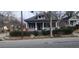Charming two-story home with a screened-in porch and landscaped front yard at 540 Langhorn Sw St, Atlanta, GA 30310