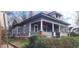Charming two-story home with a screened-in porch and painted brick accents at 540 Langhorn Sw St, Atlanta, GA 30310