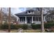 Charming two-story home with a screened-in porch and landscaped front yard at 540 Langhorn Sw St, Atlanta, GA 30310