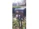 A mailbox at address '540', surrounded by yard debris at 540 Langhorn Sw St, Atlanta, GA 30310