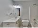 The bathroom features a vanity with storage, a toilet, and a shower with modern hardware at 805 Kilkenny Cir, Lithonia, GA 30058