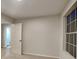 Cozy bedroom featuring plush carpet and a window at 805 Kilkenny Cir, Lithonia, GA 30058