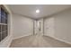 Spacious bedroom featuring neutral walls and carpet, with a large window providing plenty of natural light at 805 Kilkenny Cir, Lithonia, GA 30058