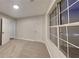 Bright bedroom featuring neutral walls and carpet, with a large window providing plenty of natural light at 805 Kilkenny Cir, Lithonia, GA 30058