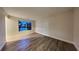 Spacious living room featuring wood-look floors and a fresh, neutral palette at 805 Kilkenny Cir, Lithonia, GA 30058