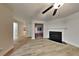 Inviting living room featuring wood-look floors and a fireplace at 805 Kilkenny Cir, Lithonia, GA 30058
