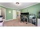 Comfortable office with neutral walls and carpet; door leads to another room at 1693 Carr Nw Cir, Atlanta, GA 30318