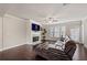 Inviting living room showcasing a fireplace, large window, and cozy sectional sofa at 2499 Village Park Bend, Duluth, GA 30096