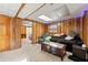 Spacious basement area featuring wood paneled walls, a comfortable seating area, and access to another room at 2671 Lee Ann Dr, Marietta, GA 30066