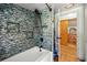 Bathroom shower featuring colorful tile backsplash at 2671 Lee Ann Dr, Marietta, GA 30066