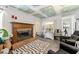 Cozy living room with brick fireplace, unique decor, and comfortable seating at 2671 Lee Ann Dr, Marietta, GA 30066
